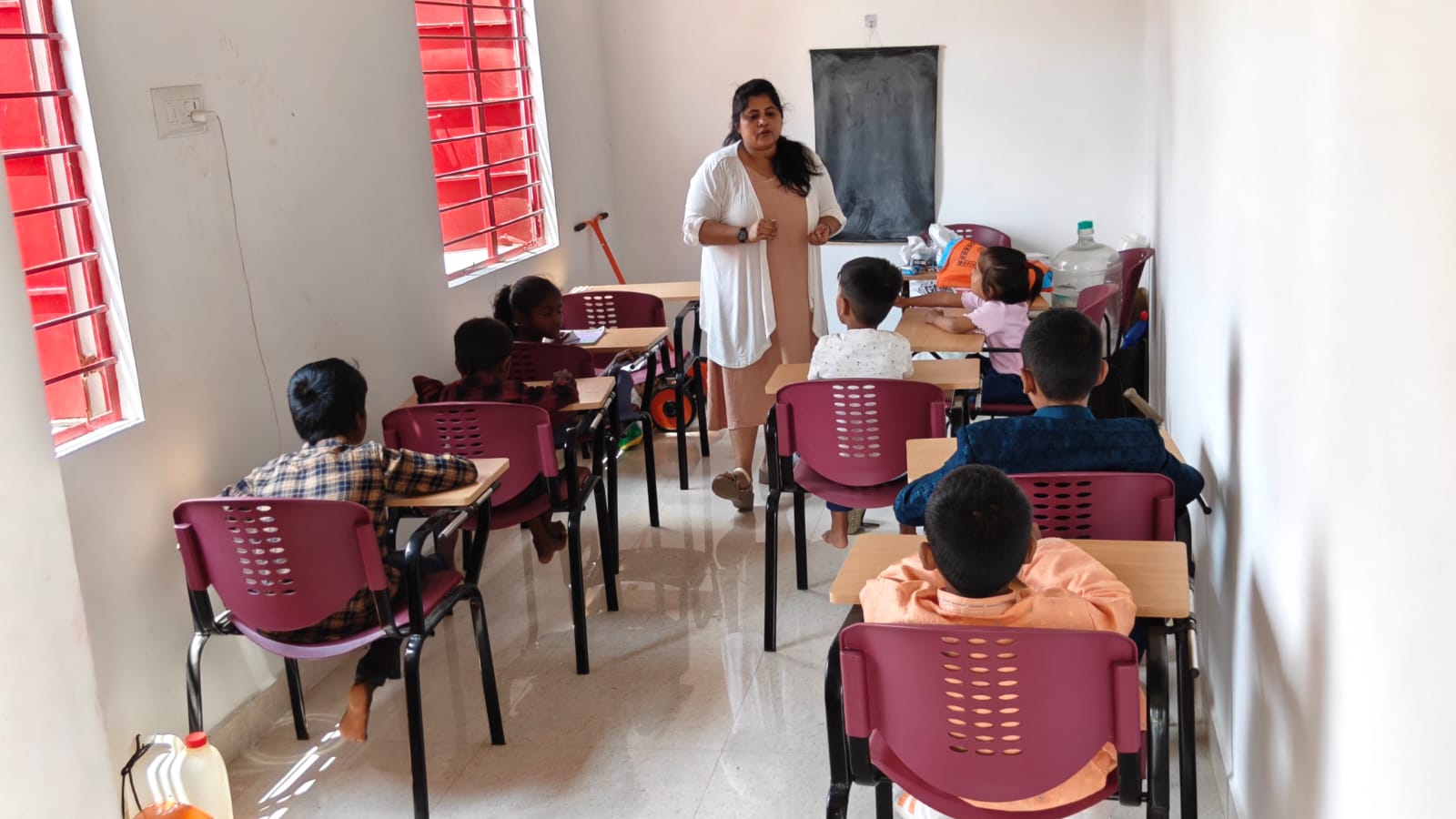 Rural bridge education classroom with students and teacher